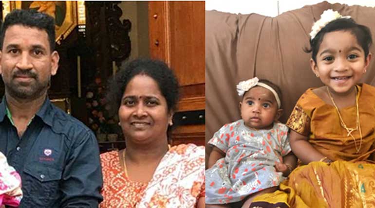 Nadesalingam and his wife Priya with 2 daughters. photo credit - change.org